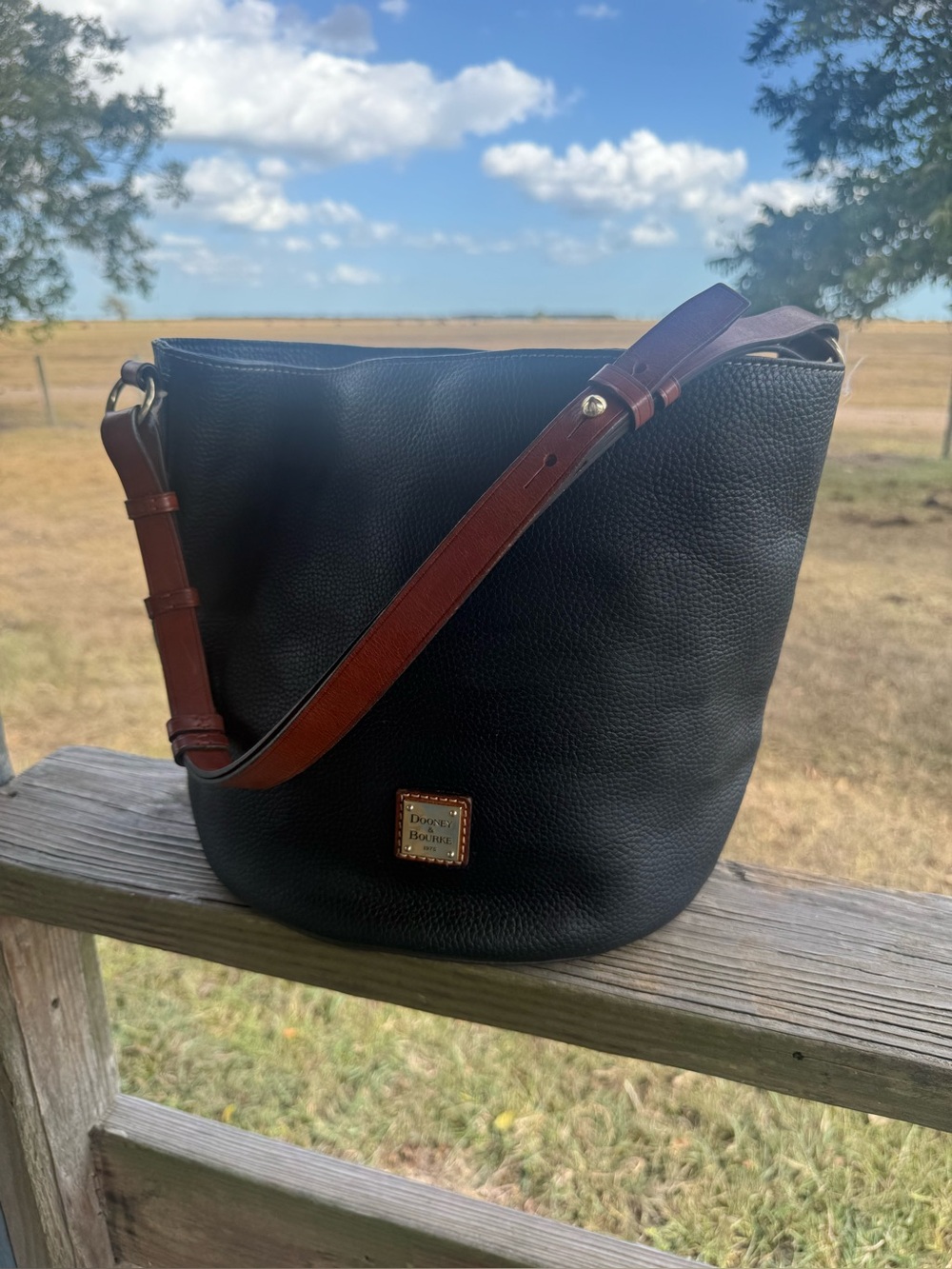 Dooney & Bourke Black Pebble Leather Messenger with Brown Strap